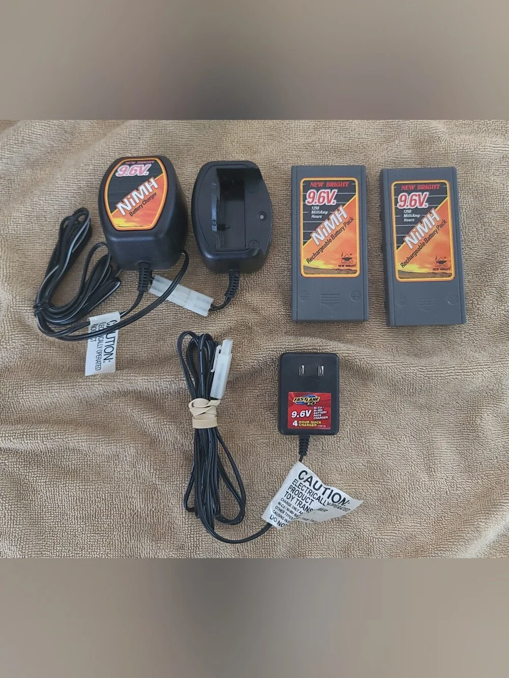 New Bright 9.6V NiMH Battery Charger and PacksNew Bright 9.6 Volts 1200 Bundle